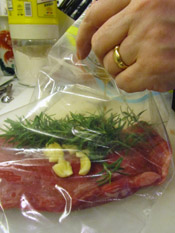 Place Steak, Garlic and Rosemary in Plastic Bag